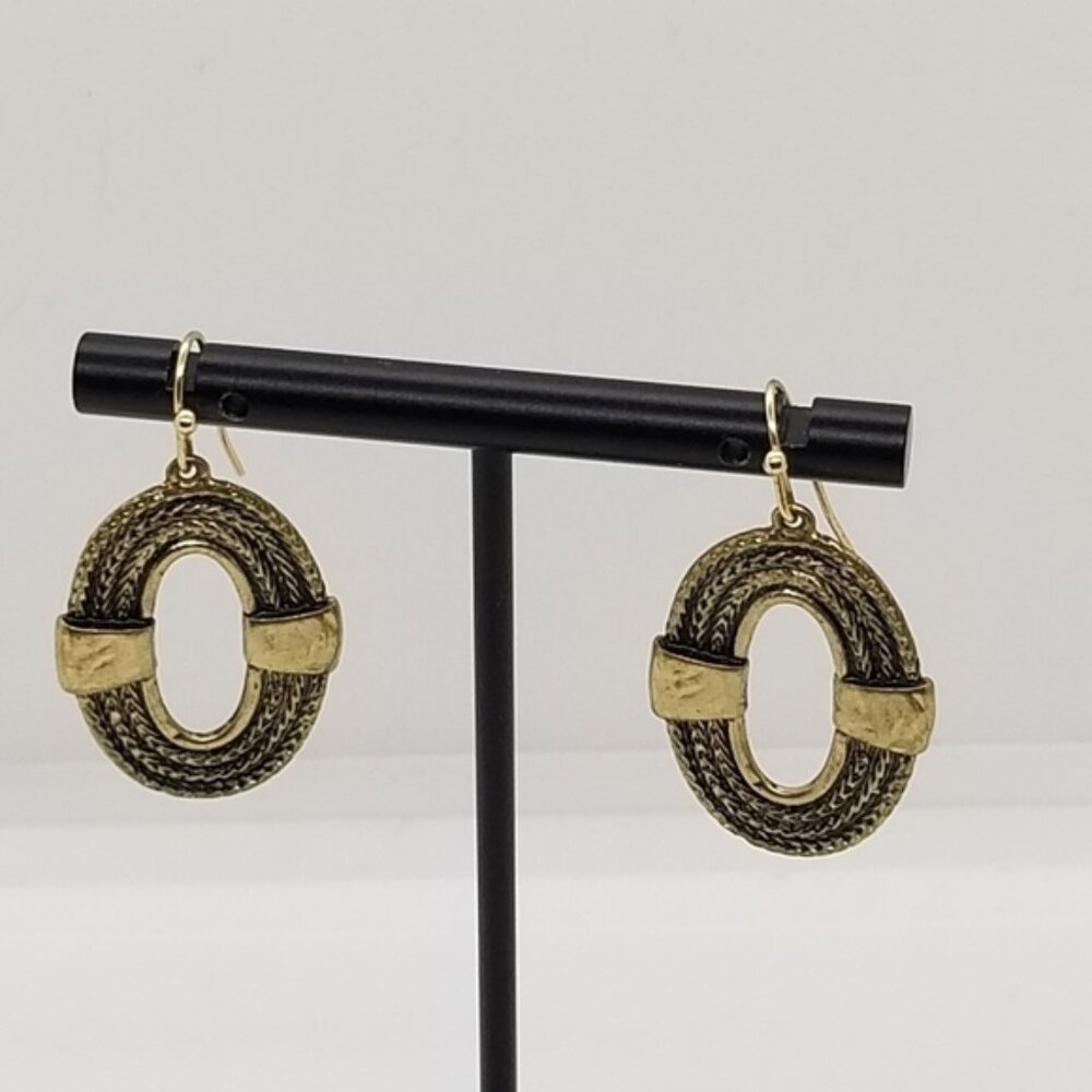 gold tone oval dangle earrings ropelike with cutout